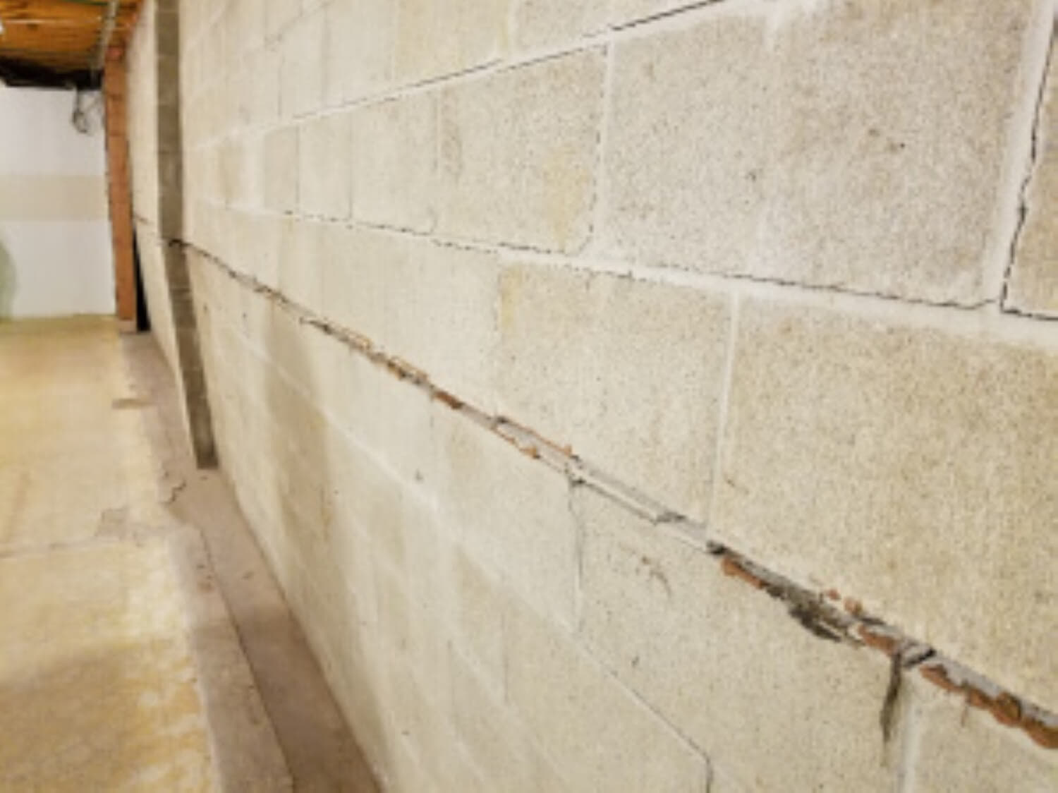 crack in block concrete wall, wall bowing inward