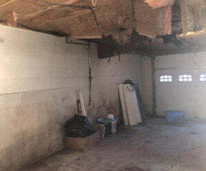 garage with bowing wall
