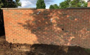 same brick wall, now repaired