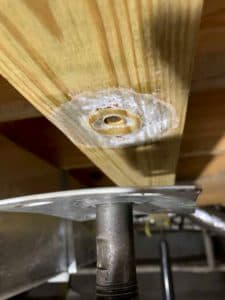 close up of wood beam and steel jack