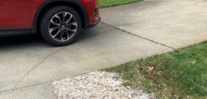cracked driveway before repairs