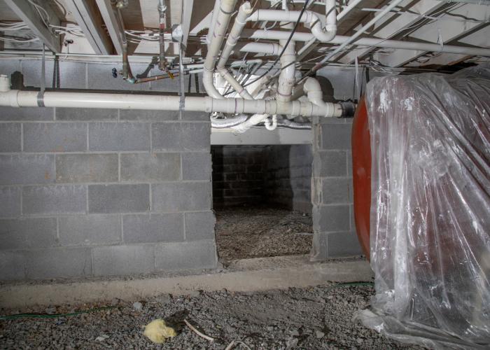 pipes in a basement fixed by foundation repair Troy MI